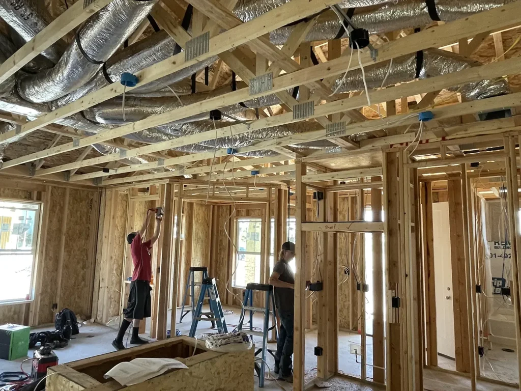 Camson Electric electricians installing electrical wiring in a new Utah home