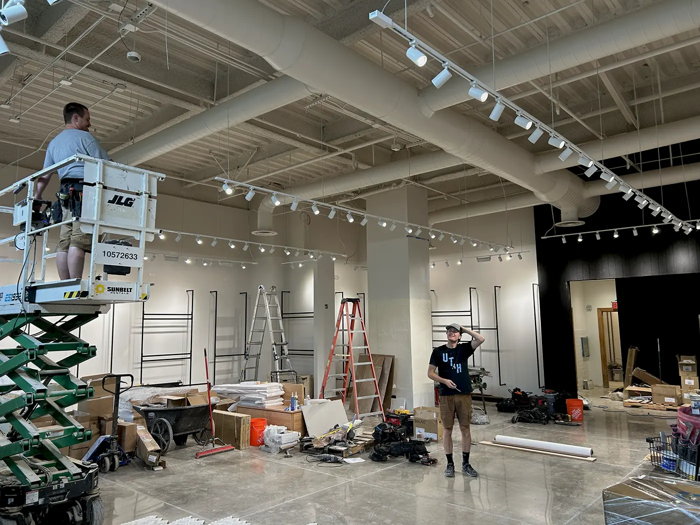 Commercial lighting installation in progress inside a retail space by Camson Electric in Utah