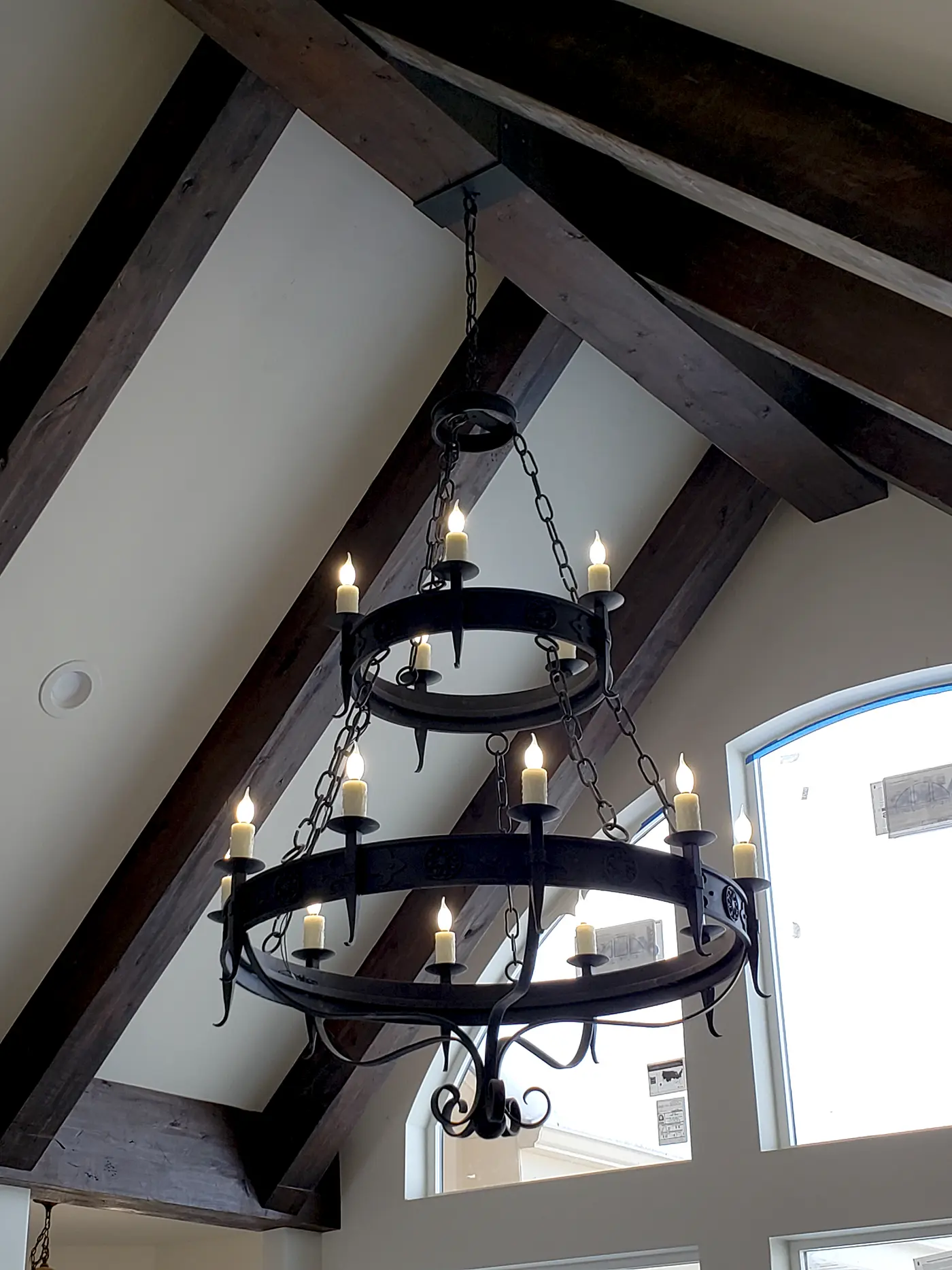 Custom chandelier installation in a luxury Utah home completed by Camson Electric