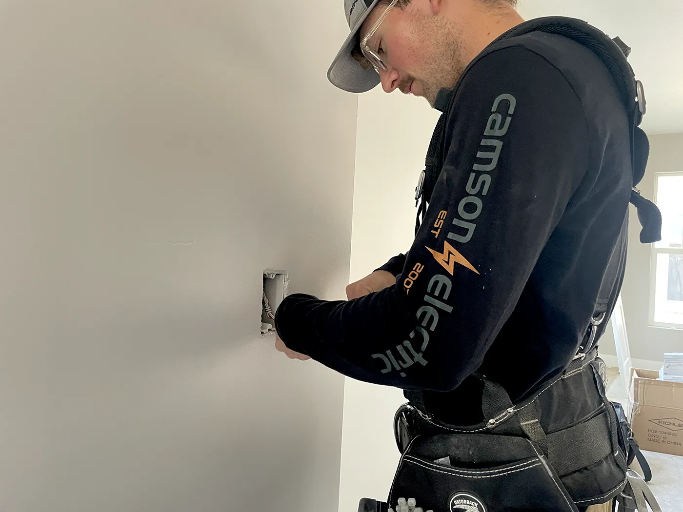 Camson Electric electrician completing electrical work inside a new residential construction project in Utah