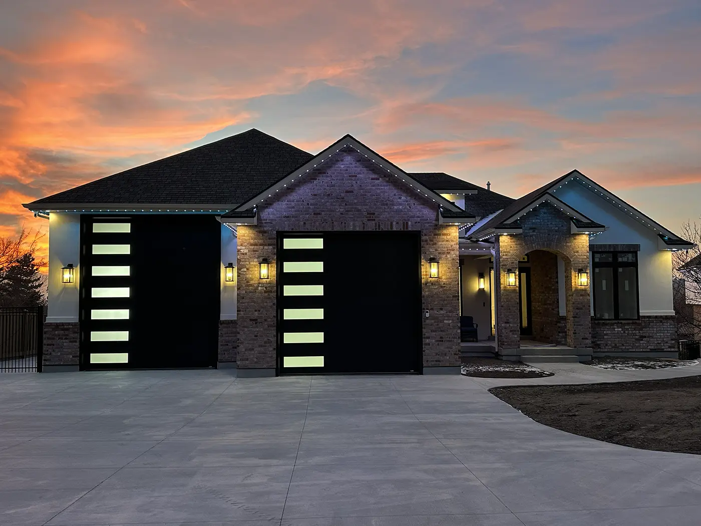Custom home with exterior lighting and residential electrical systems installed by Camson Electric in Utah