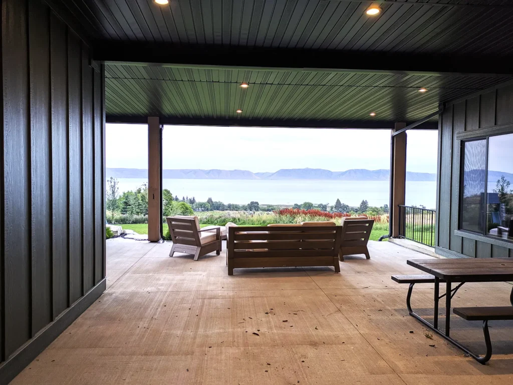 Covered deck with recessed ceiling lights and Bear Lake visible beyond